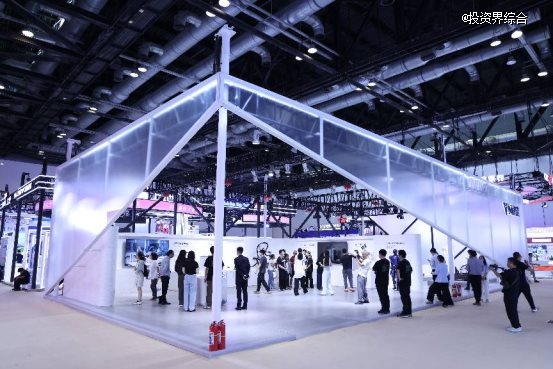 Xiaoyubot exhibition booth with visitors under dramatic lighting at an industry expo