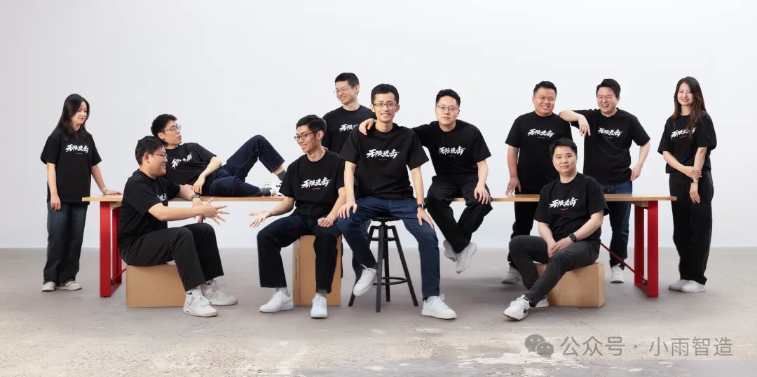 Full Xiaoyubot team in matching black tee-shirts in a studio group photo