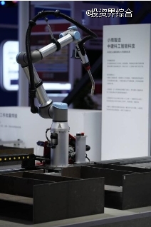 Close-up of a Xiaoyubot welding cobot arm displayed at an expo booth